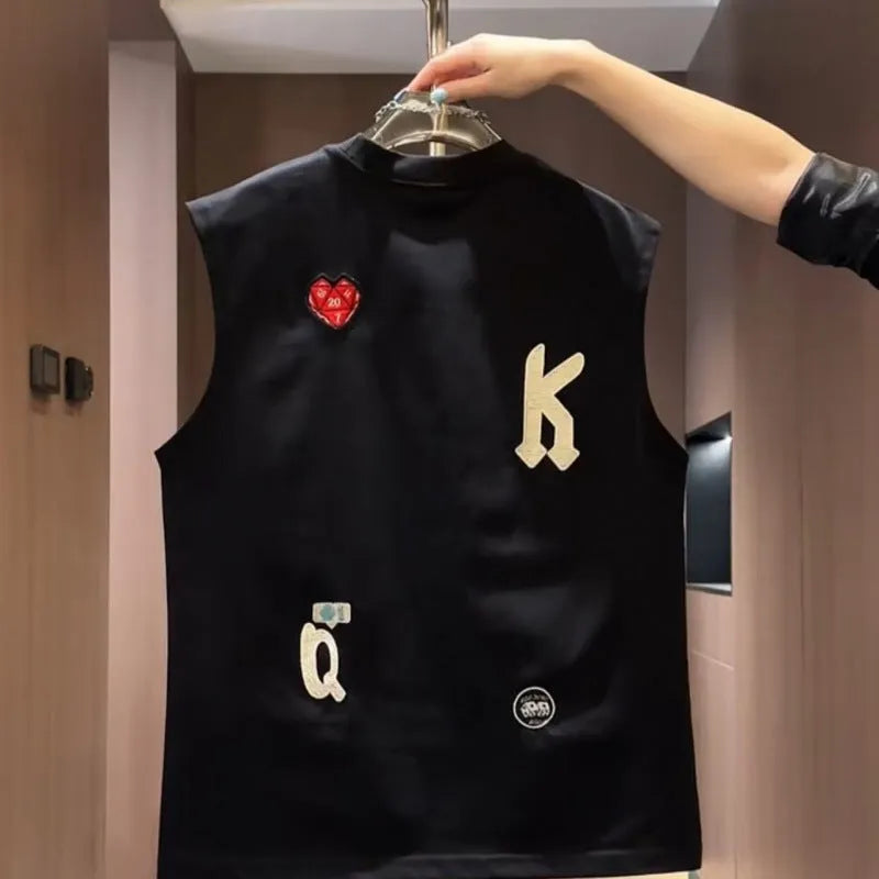 Men's black cotton sleeveless vest with a cartoon graphic print, laid flat.