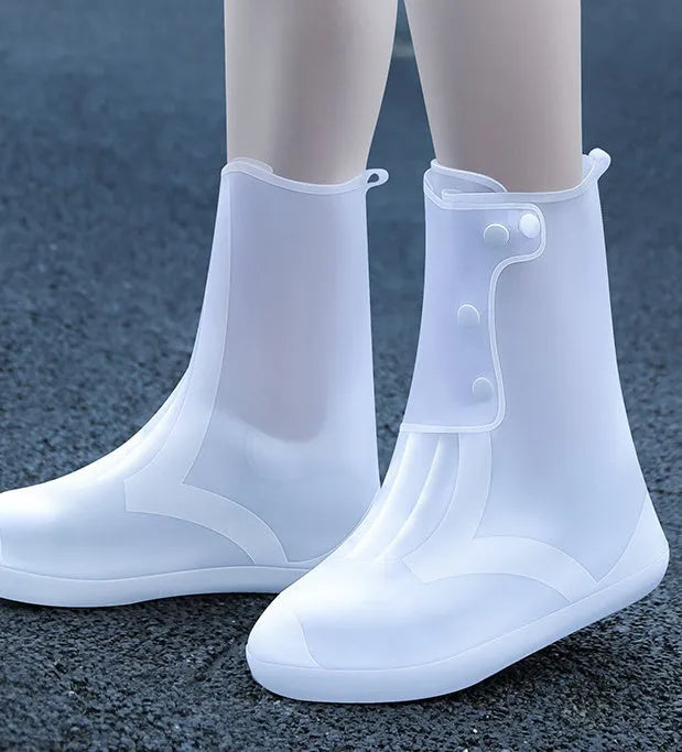 White high-top PVC reusable shoe covers for women with anti-skid sole.