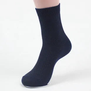 Men's bamboo fibre socks in a small square pattern, shown in neutral colours including grey and navy.