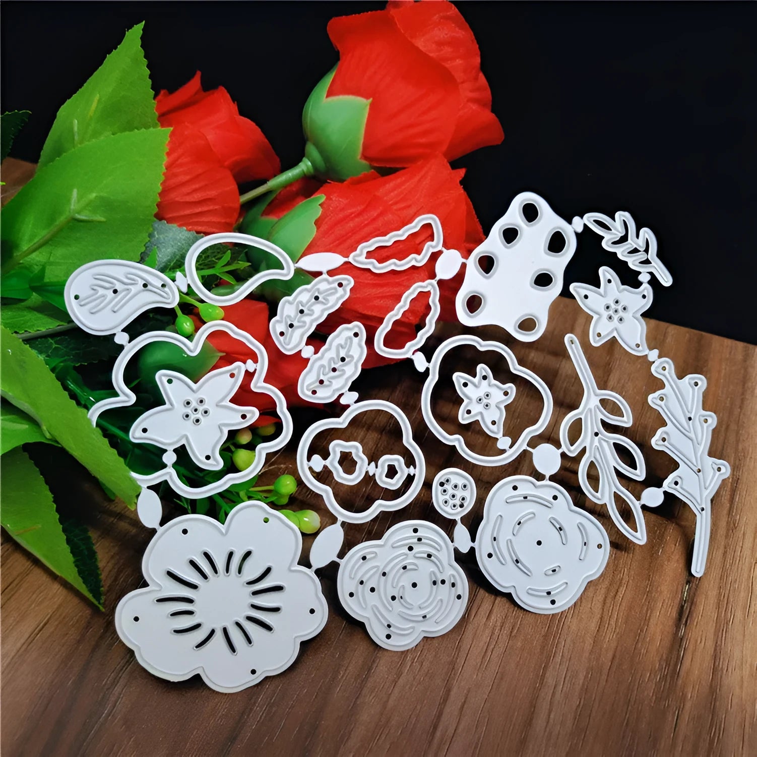 Silver carbon steel flower paper cutting die measuring 14.3 by 9.9 centimetres.