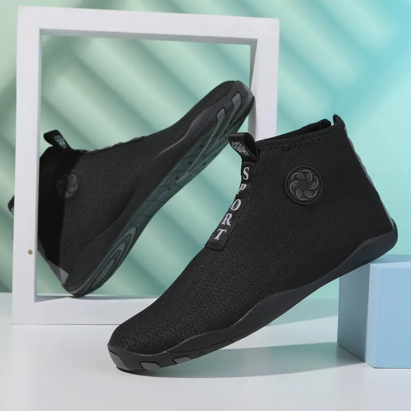Mid-top breathable mesh beach water shoes in black and fluorescent green with a textured non-slip rubber sole.