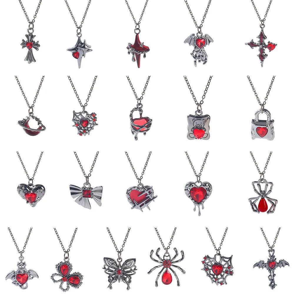 Gothic Halloween necklace with electroplated alloy pendant showing bat, spider, or cross design on a metal chain.