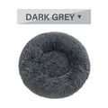 Fluffy donut-shaped dog bed with raised rim in plush fabric, available in multiple colours and four sizes