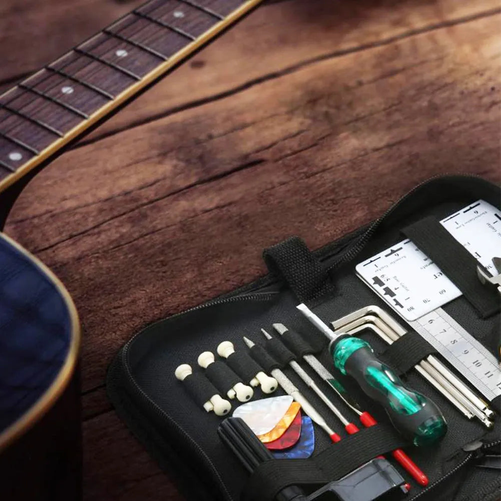 Black plastic and metal guitar repair tool kit for guitar bass mandolin banjo maintenance