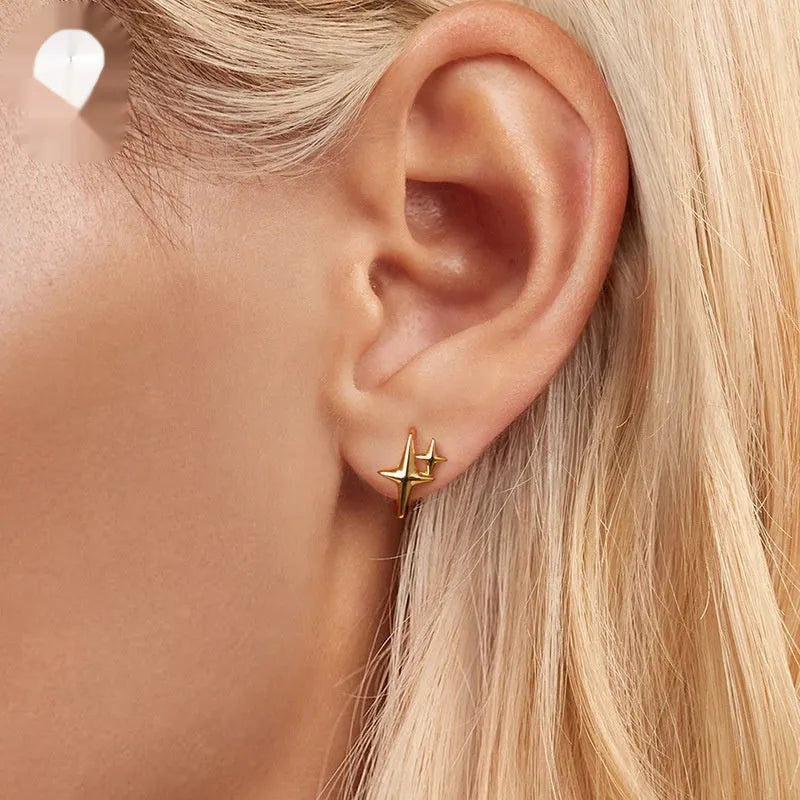 Minimalist star design clip-on earrings in sterling silver with oxidation treatment finish