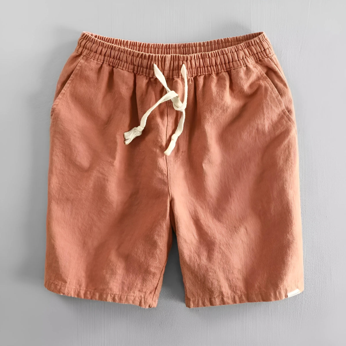 Man wearing loose-fitting cotton and linen casual shorts in a straight-leg style with an elasticated waist.