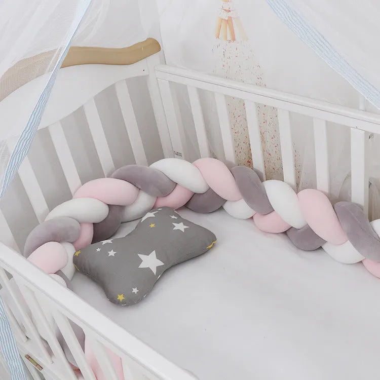 Baby crib bumper braid knot pillow cushion in spandex velvet fabric, shown in a multi-colour option.