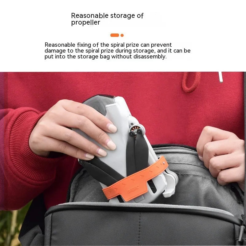 Paddle binding device silicone ABS clip in grey on a kayak paddle blade
