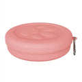 Portable collapsible silicone dog bowl with a clip-on snack compartment lid in green and pink colours