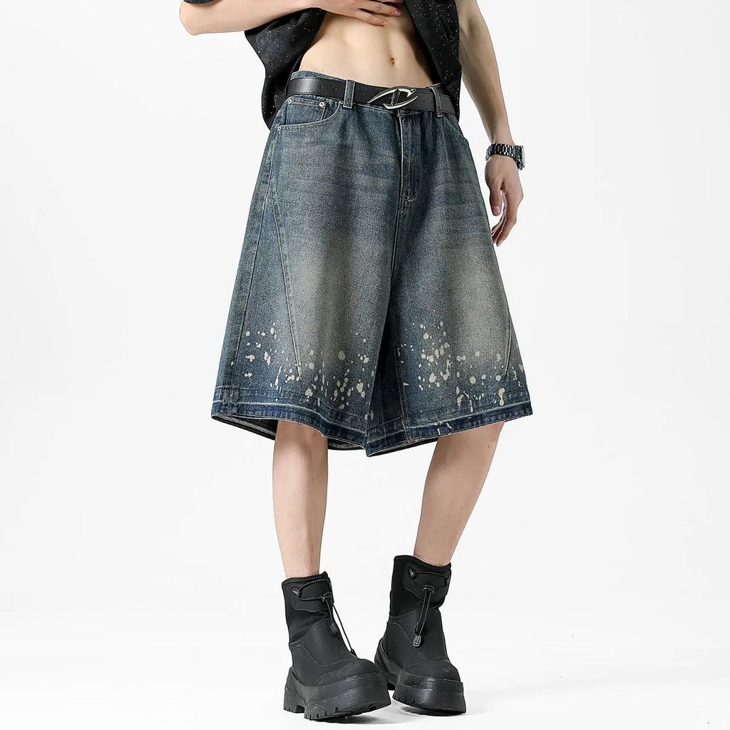 Men's retro blue denim shorts with ripped details and splash ink pattern