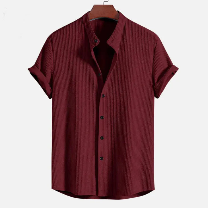 Men's loose-fitting short sleeve casual shirt in light blue polyester fabric.