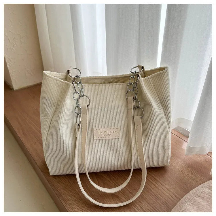 Corduroy one-shoulder tote bag in horizontal square shape with three-dimensional pocket
