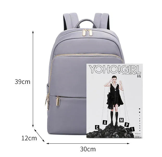 Oxford cloth women's large capacity backpack in black shown with anti-theft zip and breathable back panel.