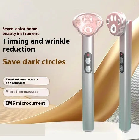 Pink gradient cat's paw shaped eye massager with micro-current vibration and colour light therapy.