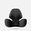 Black grey memory foam automotive lumbar support pillow and headrest on a car seat.