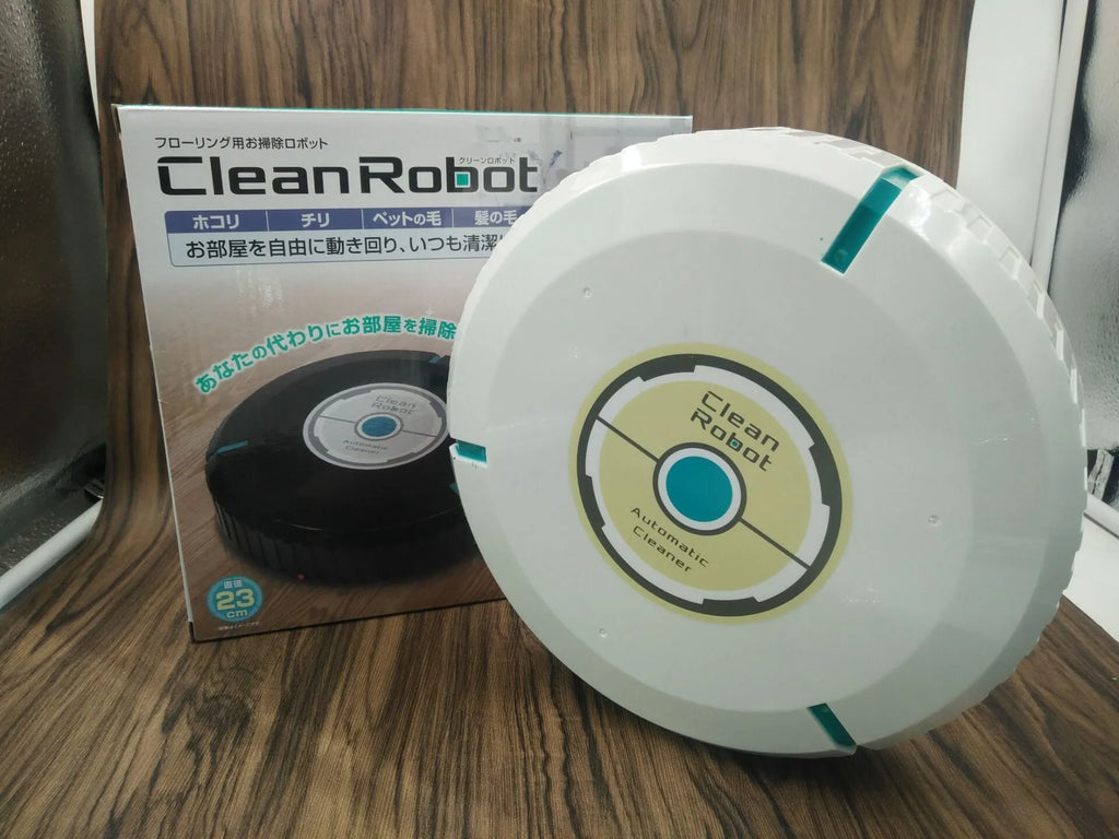Black or white AC automatic sweeping robot on a hardwood floor next to a dust bin.