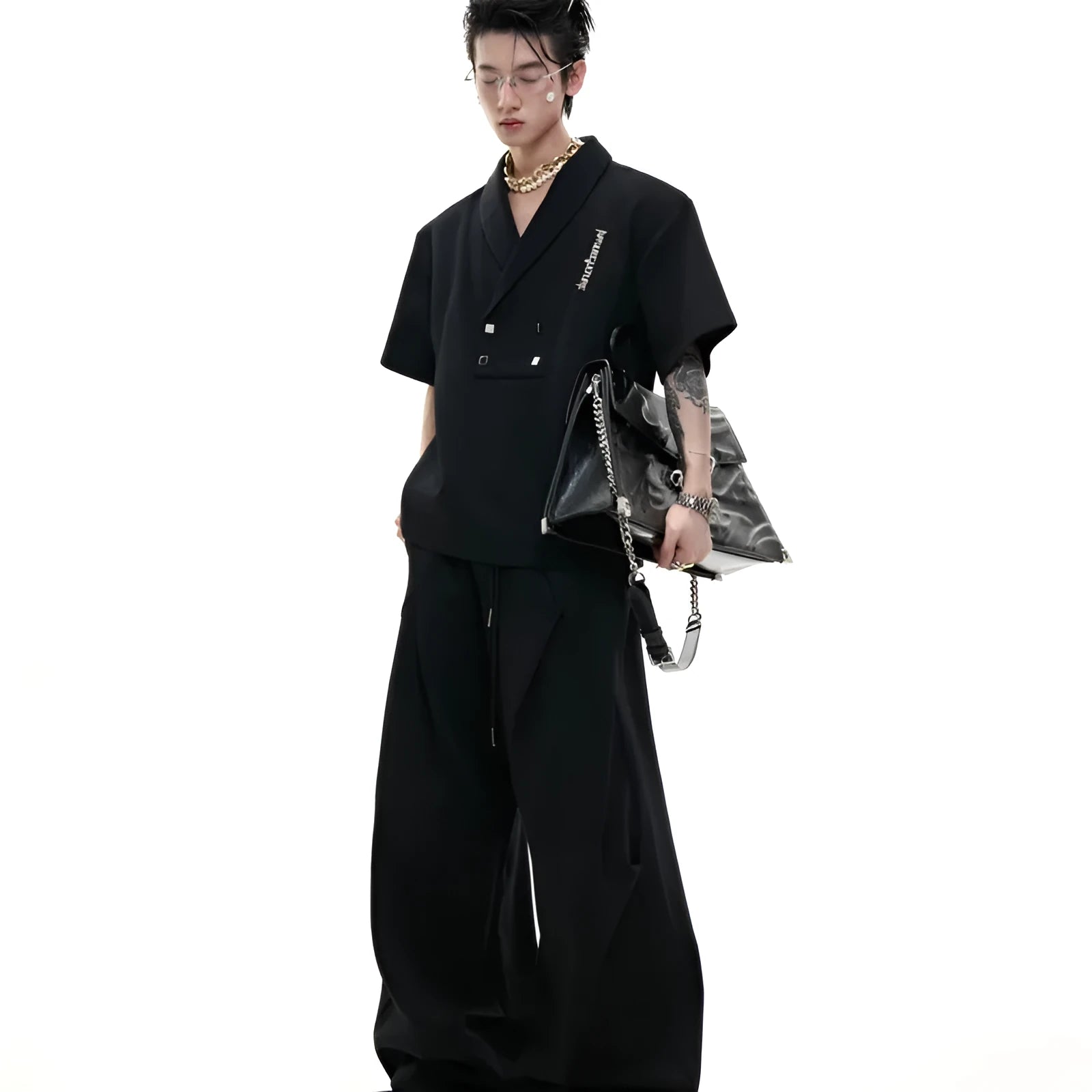 Men's dark grey V-neck padded shoulder sports suit with metal embellishments and matching shorts