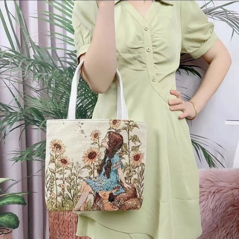 Double-sided embroidered canvas bag with gold wire detailing showing botanical pattern