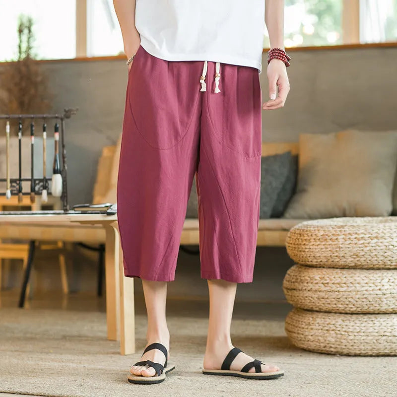 Straight leg linen shorts in khaki colour with skinny ankle opening on plus-size model