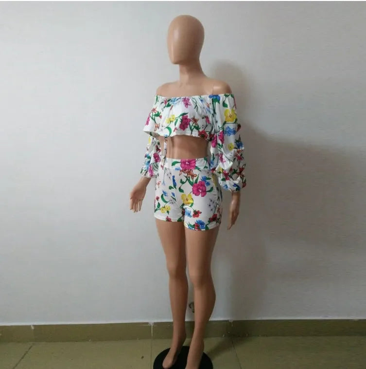 Women's two-piece set with multicolour digital print, pile sleeves on crop top, and matching shorts.