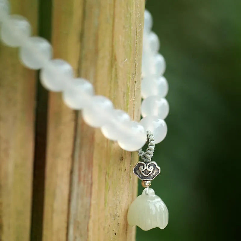 S925 silver bracelet with white agate and Hetian jade stones showing lotus geometric design
