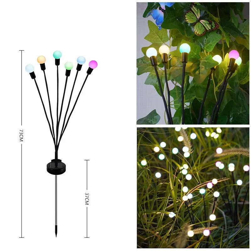 Solar-powered LED garden lamp with multiple light heads and ground plug stakes on a lawn