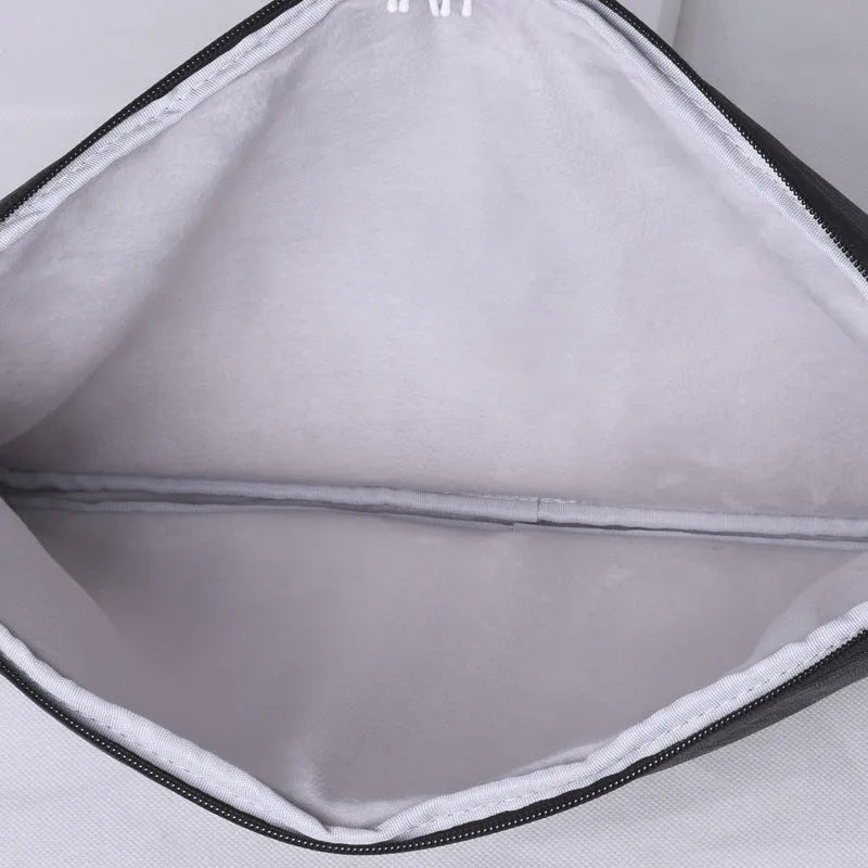 Slim water-repellent polyester laptop sleeve in light grey or dark grey, fits 13, 14 and 15 inch laptops