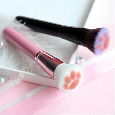 Cat paw brush with fibre bristles, birch wood handle, and aluminium tube in black colour option