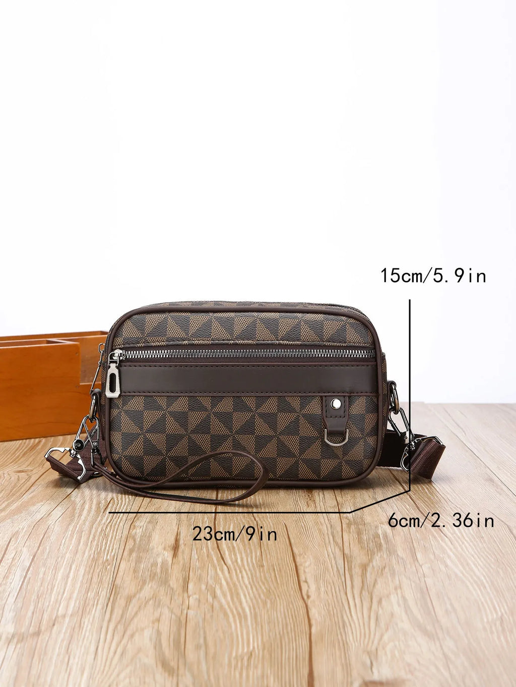 Men's black PU leather messenger bag with geometric pattern, showing horizontal shoulder carry design