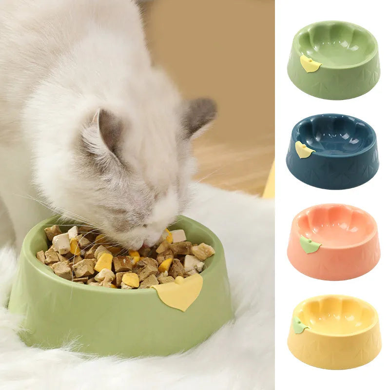 Green plastic pet double bowl with food and water compartments showing anti-tipping design