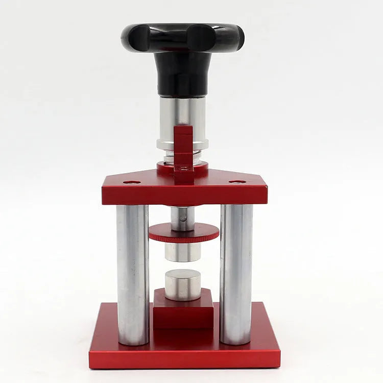 Watch repair spiral presser tool with a set of 20 plastic moulds for case backs on a grey surface