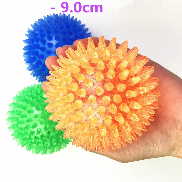 Large dog vocal toy ball in green TPR material with squeaker, 11cm diameter, on a white background