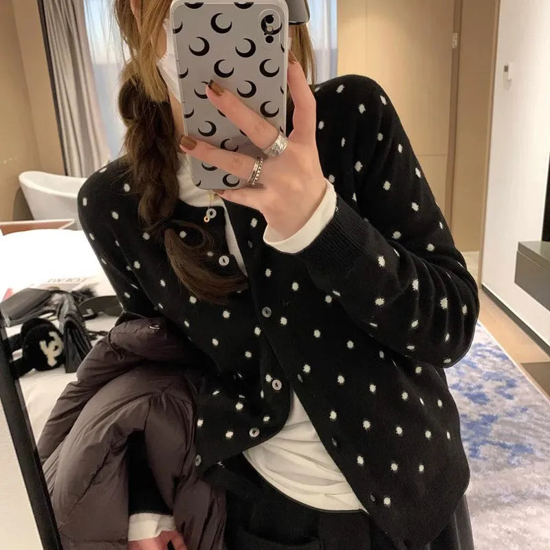 Women's grey dot knitted cardigan with crocheted flower detailing and long sleeves