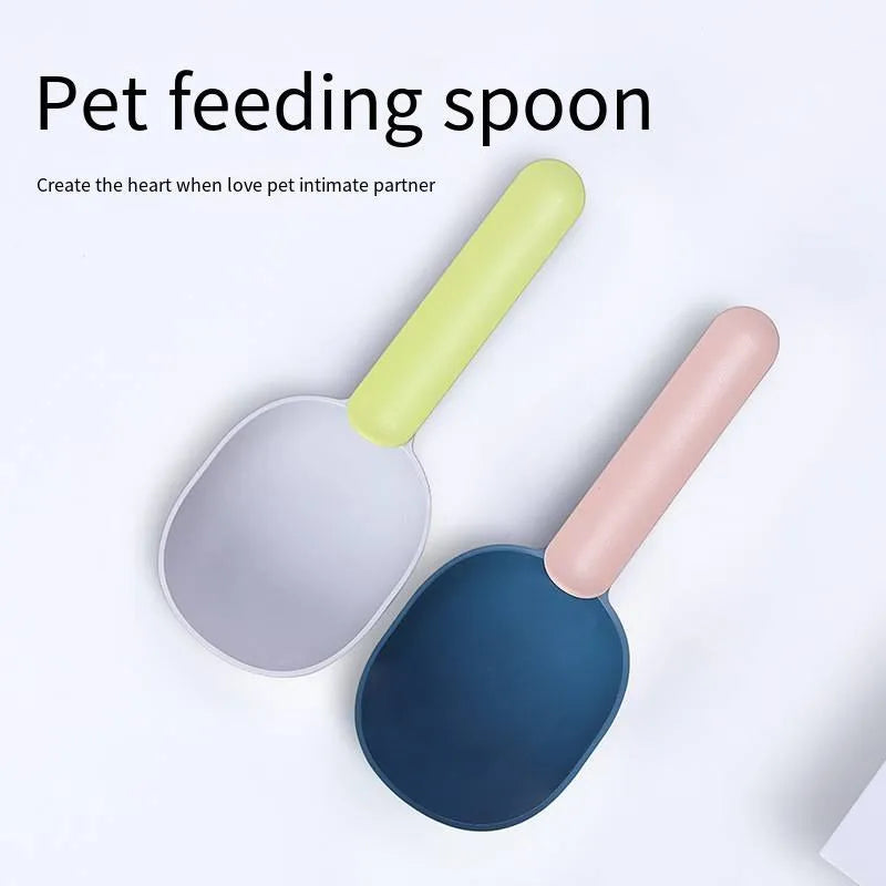 Blue plastic pet food scoop with 1 cup measure and bag clip handle on white background