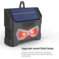 Black solar-powered ultrasonic outdoor animal repeller device with charging cable.