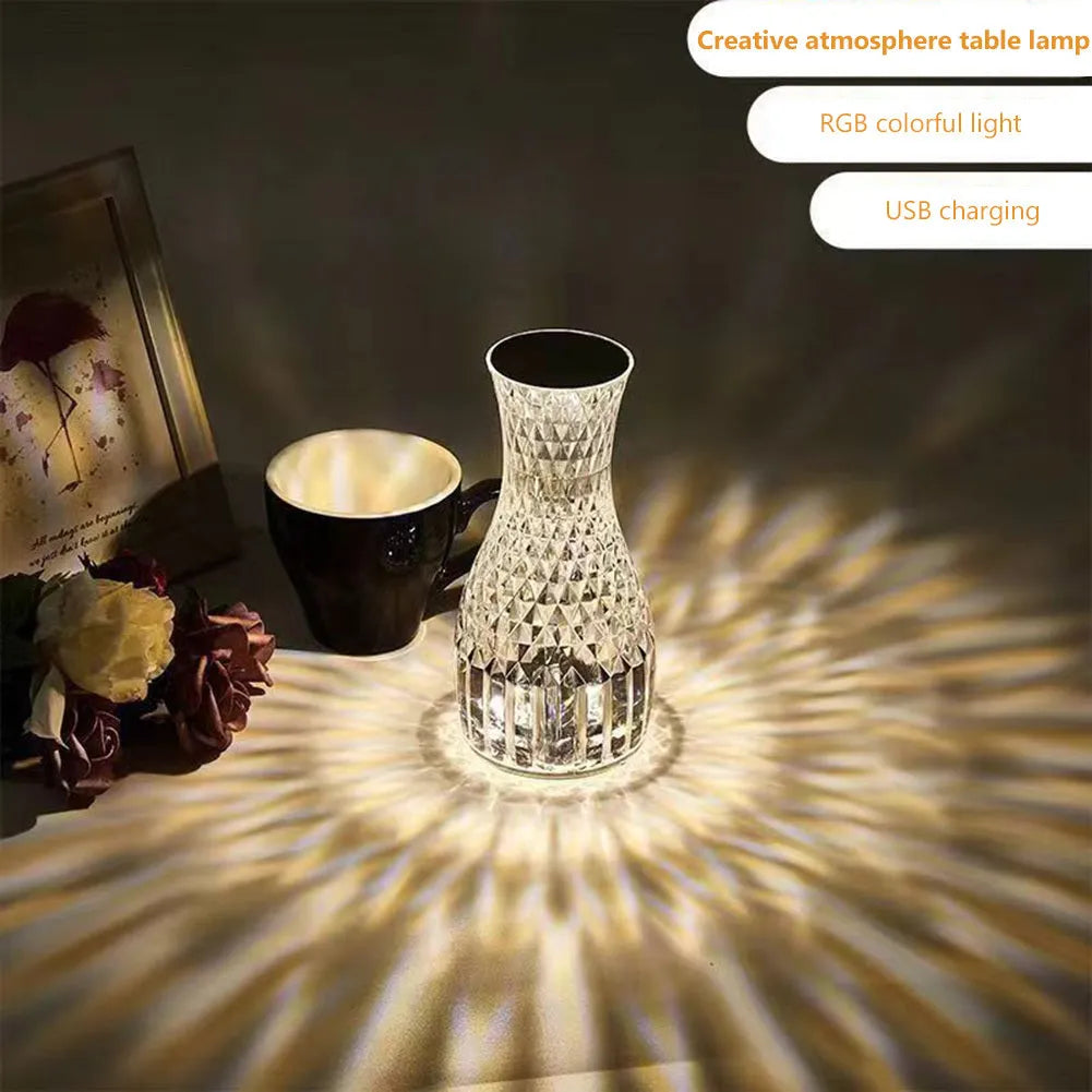 Crystal vase-shaped table lamp with remote control on wooden bedside table