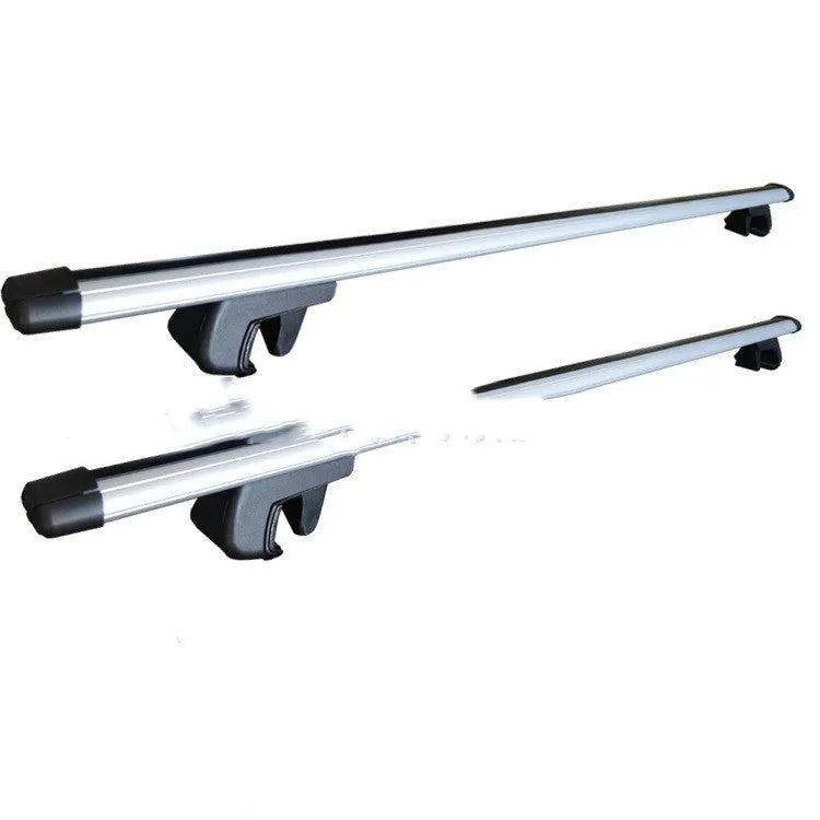 A pair of alloy roof rack crossbars for a General Motors SUV on a vehicle roof.