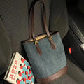 Denim patchwork polyester bucket handbag showing structured shape and one-shoulder strap