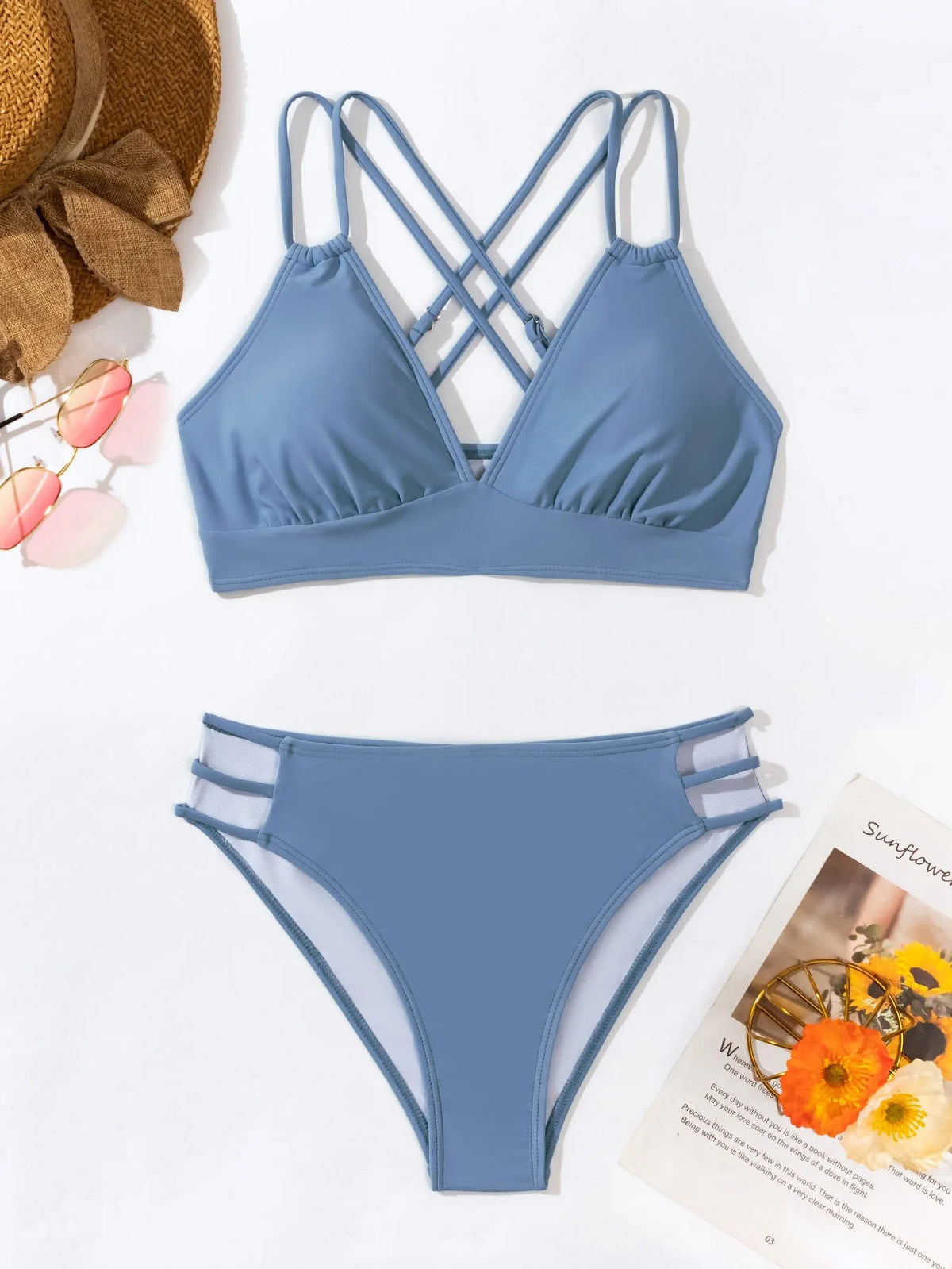 Adult women's black V-neck halter bikini with split-leg high-cut shorts.