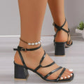 Plus size women's open toe sandal slippers with an ankle buckle strap in rose red, shown on a foot.