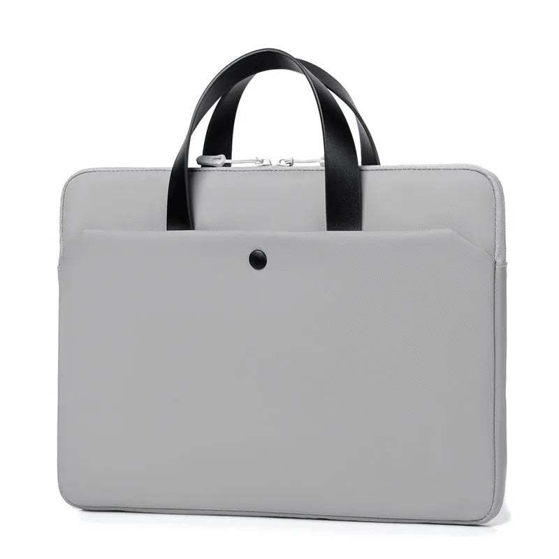 Ultra-thin leather laptop case in light gray with zipper closure and soft handle for 15.6-inch laptop
