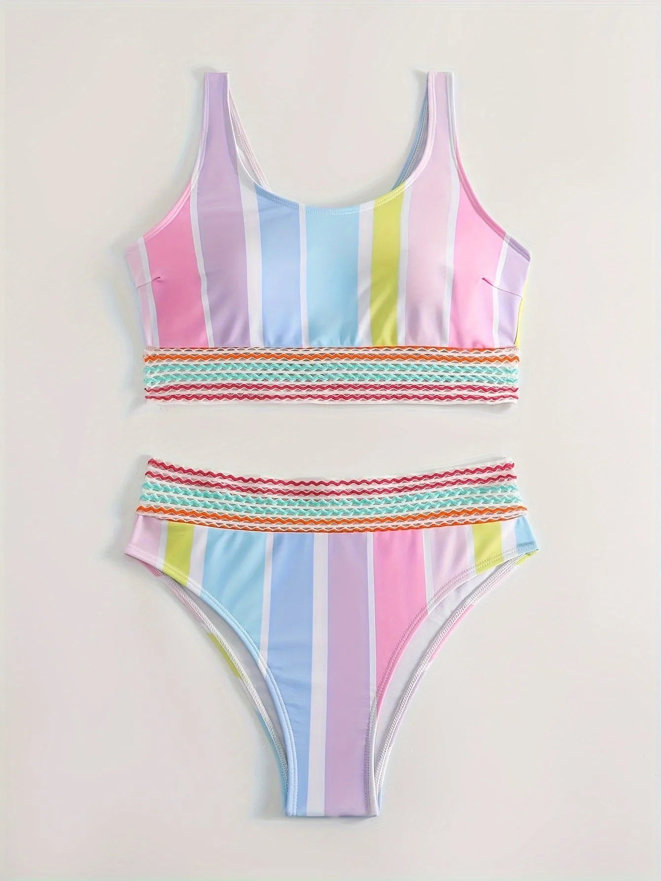Women's striped sports bikini top and briefs set on a white background