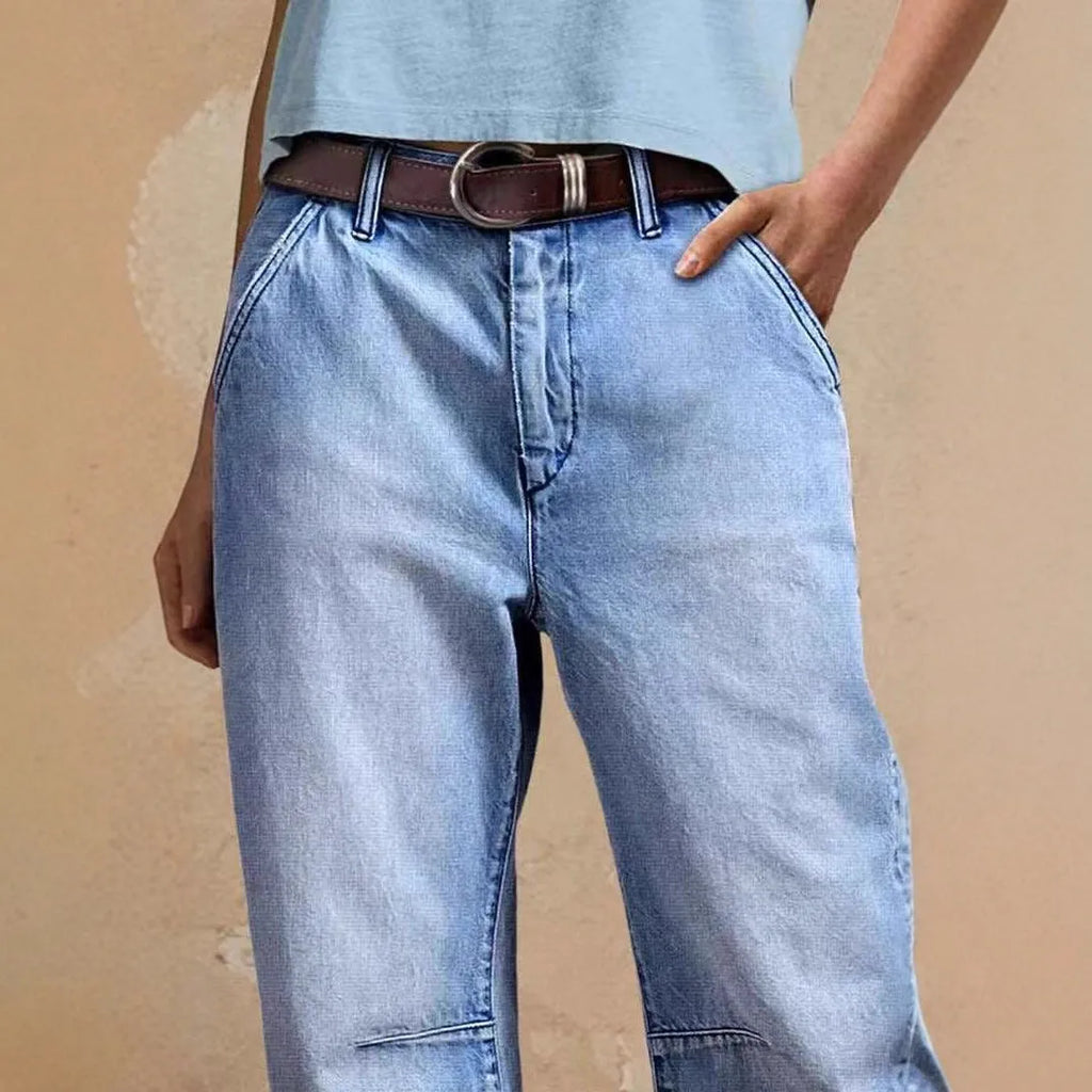 Casual cotton denim loose jeans trousers in light blue with washed finish, street hipster style
