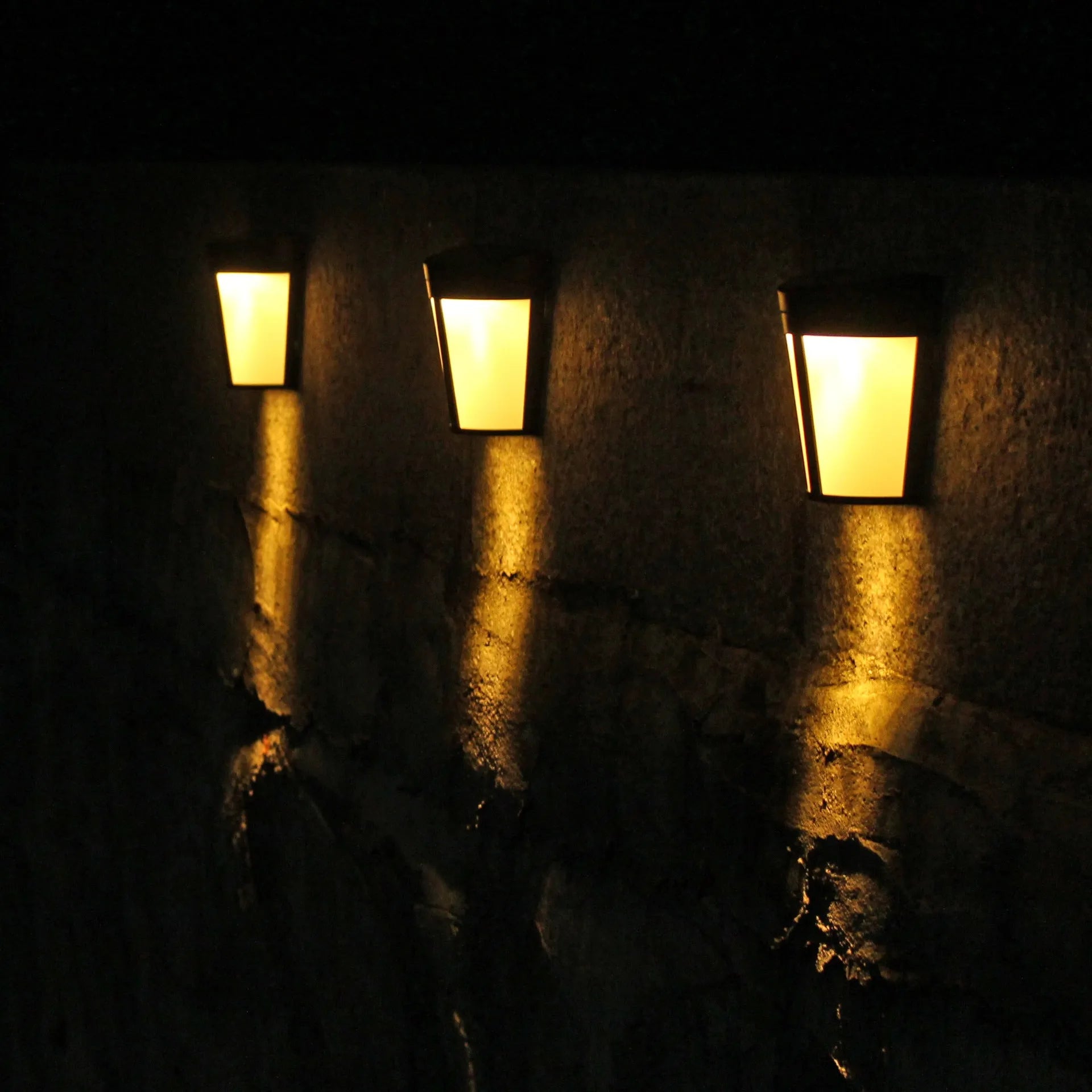 Solar-powered outdoor wall lamp with six LEDs and IP65 waterproof rating for garden and courtyard lighting