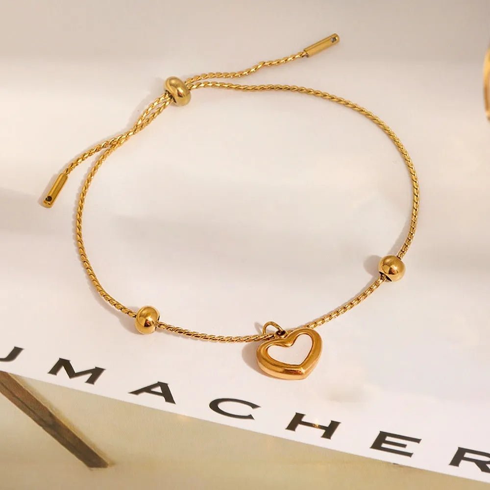 Titanium steel heart-shaped real shell bracelet with gold electroplating and regular chain, 31-40cm