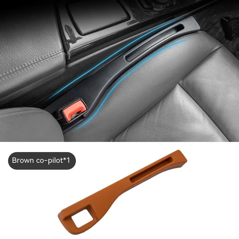Black plastic car seat gap storage organiser box with a handle.