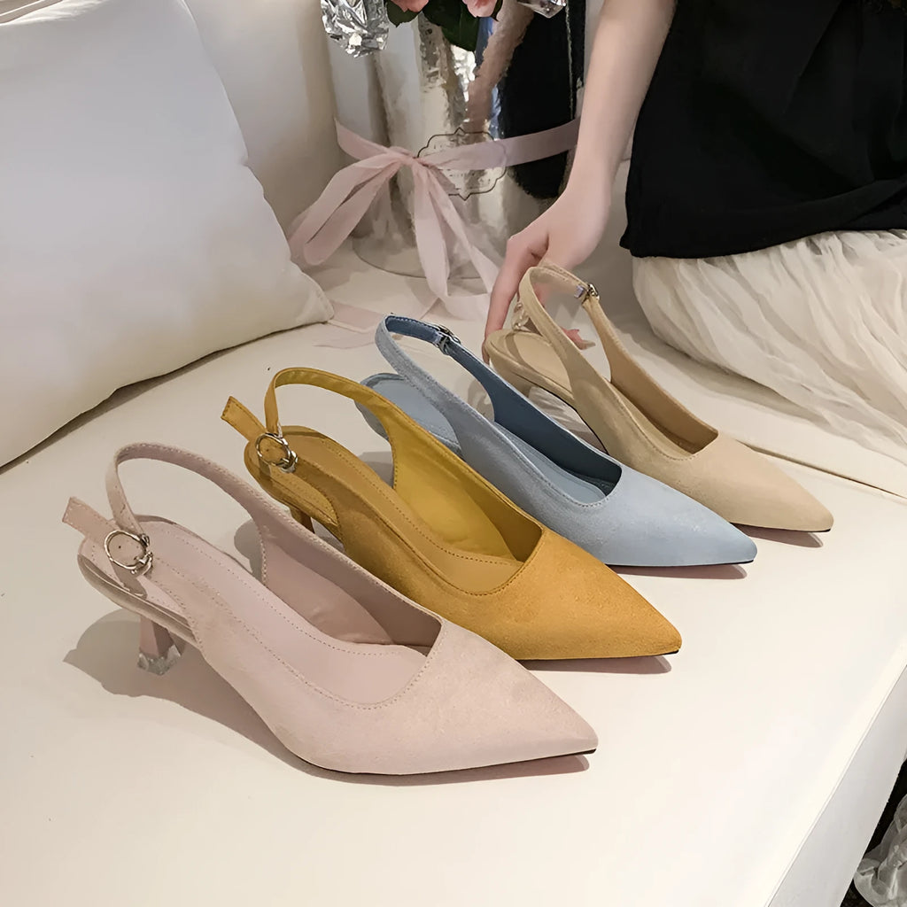 Women's apricot suede pointed-toe stiletto high heels on a neutral background.
