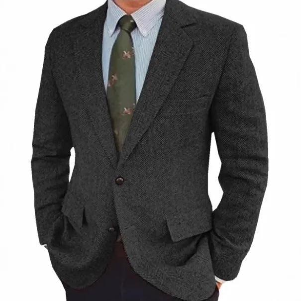 Man wearing a brown herringbone pattern retro-style suit jacket with long sleeves.