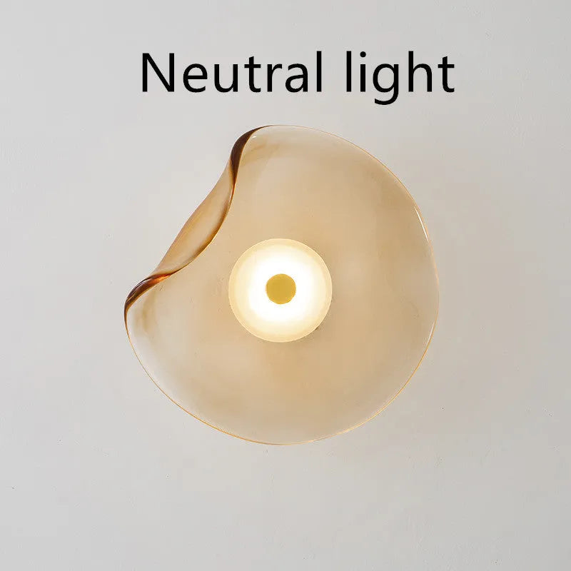 Round decorative wall lamp with glass shade in cognac colour for bedroom bedside lighting