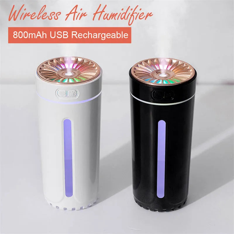 Black and white portable wireless humidifier with LED lights on a car cup holder and desktop